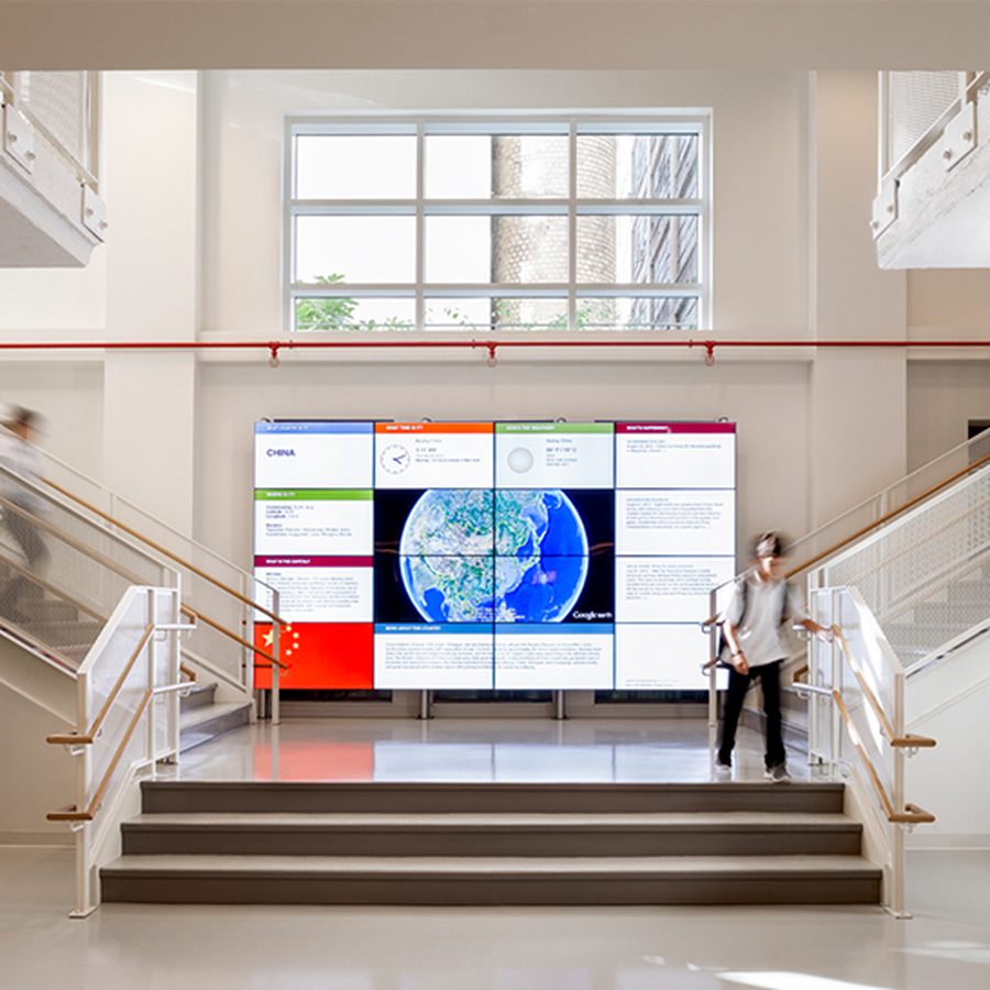 Avenues student walking down stairs at the Avenues NY campus