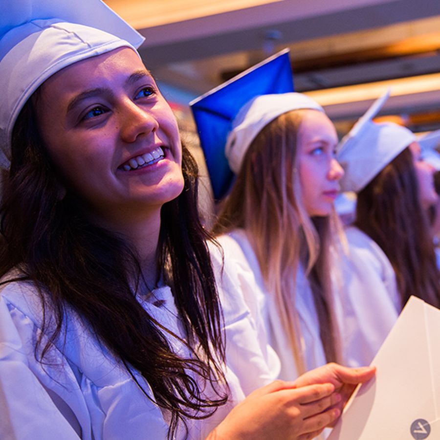 Avenues students in caps and gowns at graduation